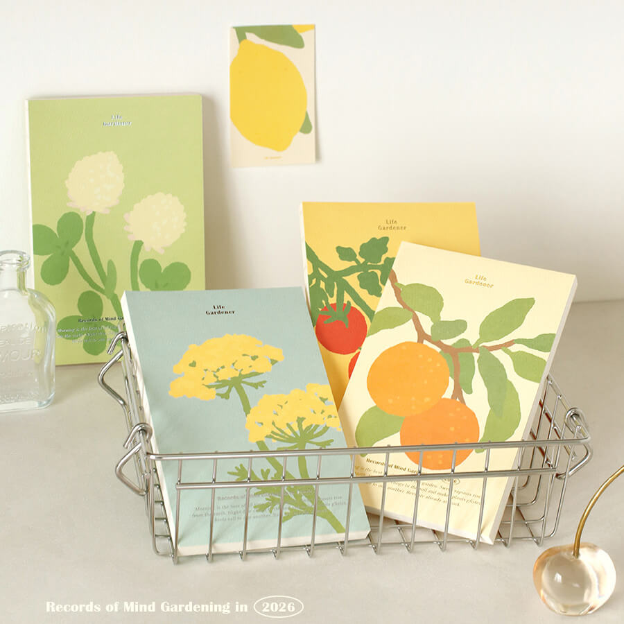 Set of gardening-themed notebooks with illustrations on a white surface.